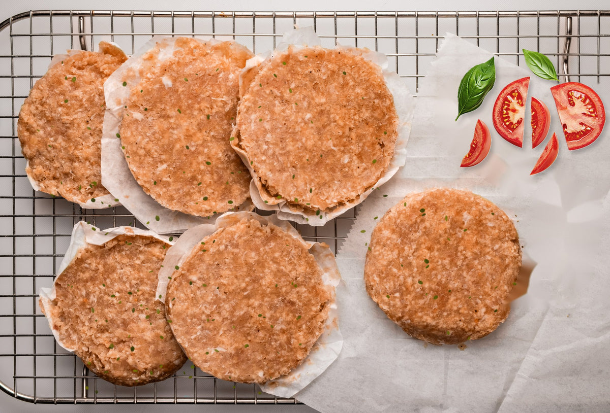 6 tomato basil chicken burger patties with fresh tomato and basil